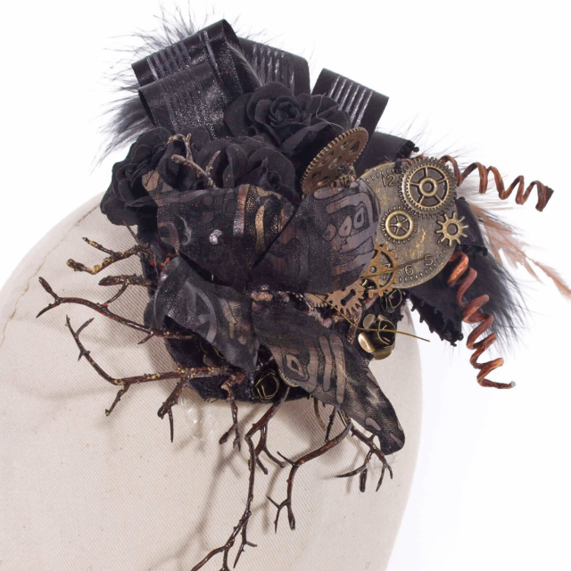RQ-BL Steampunk mini hat (SP043) with a retro-futuristic arrangement of black flowers, a butterfly, gears, bows and feathers.
