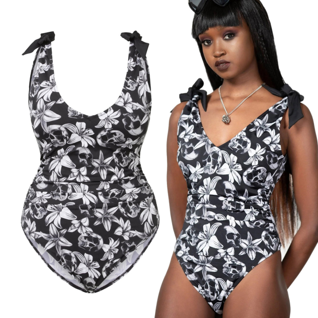 KILLSTAR Nerissa Swimsuit - KILLSTAR Nerissa swimming costume with a Hawaiian-inspired gothic all-over print with flowers and skulls, ruffled side seams, bow design on the shoulders and deep V-neckline. With removable cup padding.